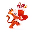 Vector flat cartoon illustration of new year and merry Christmas mascot tiger funny character carry xmas stocking full of gifts